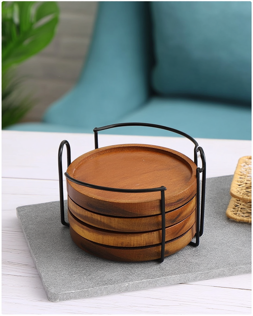 Four round acacia wood coasters with a grooved rim, stacked upright in a black wire caddy